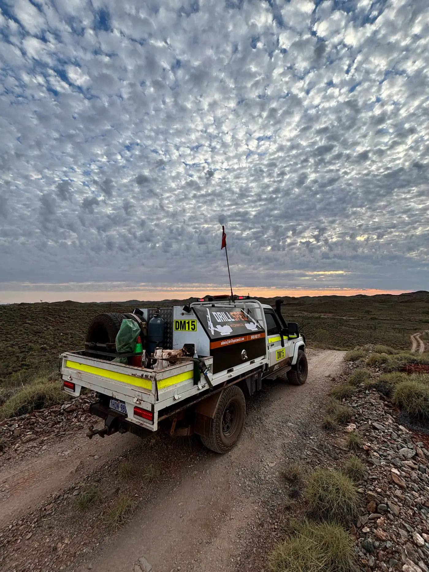 Drillspec DM15 service ute on a remote exploration track at dusk