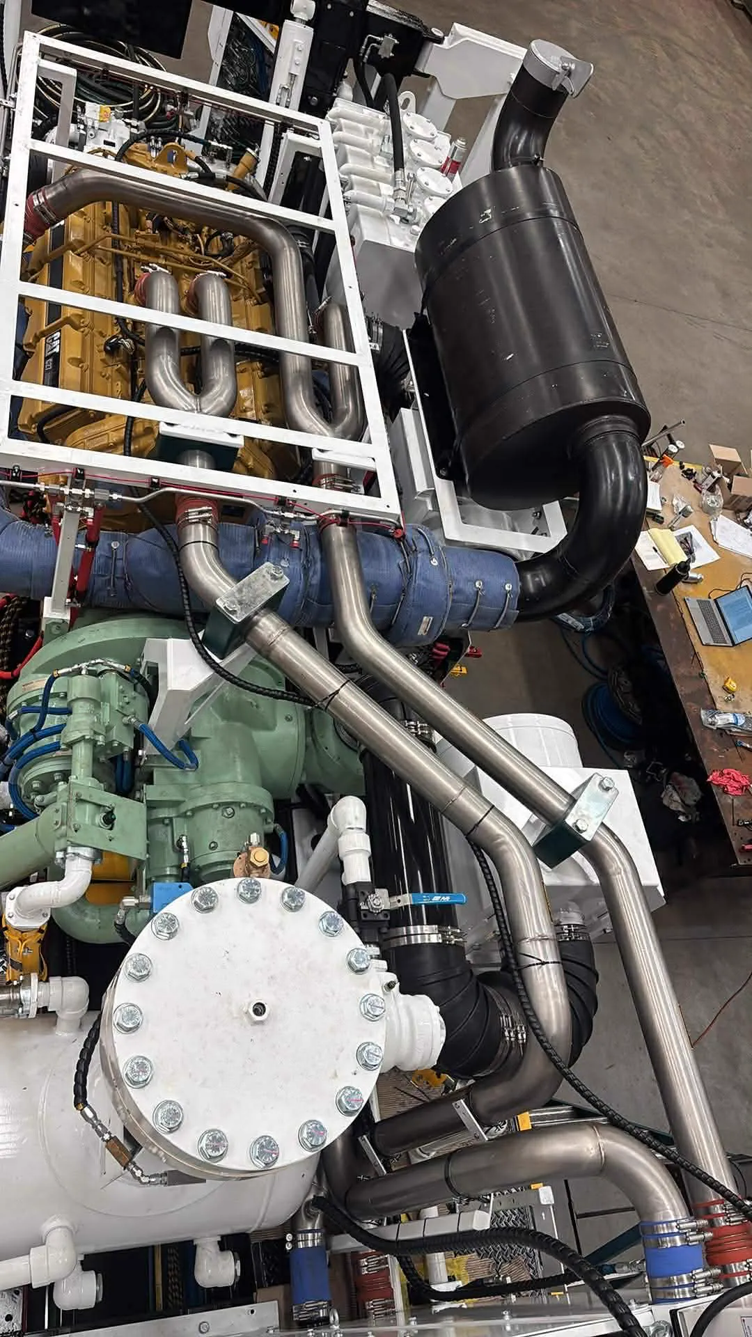 Rebuilt CAT power pack and compressor with fresh stainless exhaust pipework on the rig in the Perth workshop